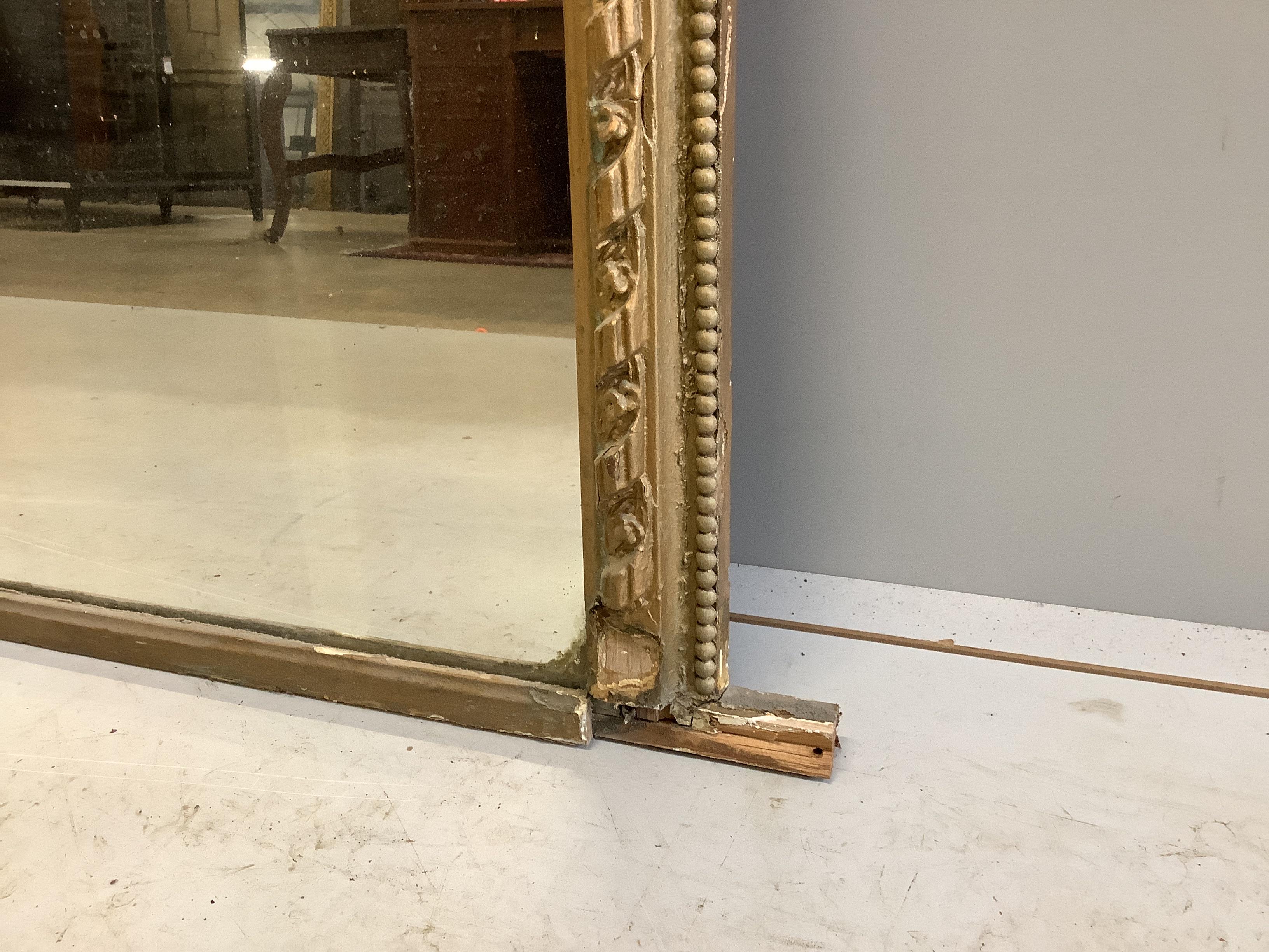 A Victorian giltwood and composition overmantel mirror, width 104cm, height 101cm